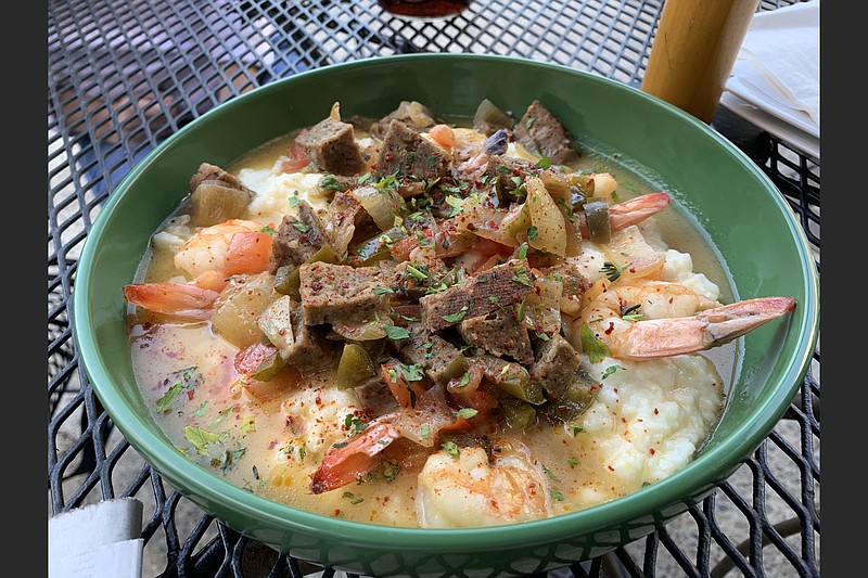 South on Main's Shrimp and Grits features plump Gulf shrimp, house andouille and butter-cream grits in a beurre blanc.
(Arkansas Democrat-Gazette/Eric E. Harrison)