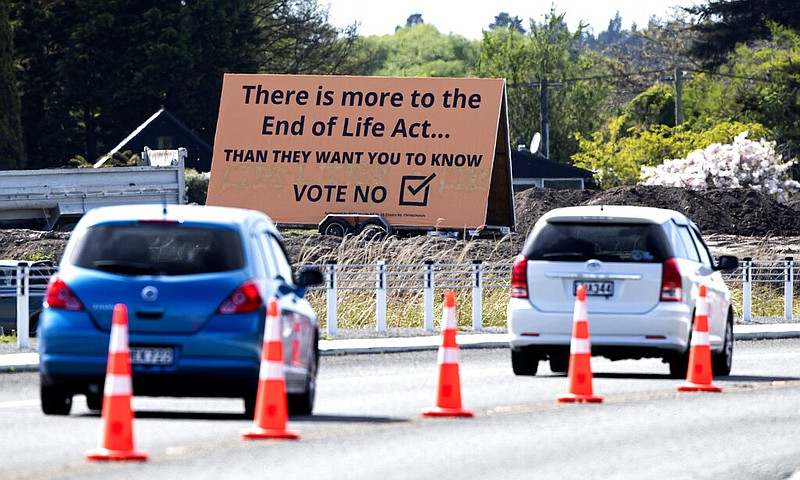 Cars drive past a billboard in Christchurch, New Zealand, in this Oct. 16, 2020, file photo. The billboard urged New Zealanders to vote against legalizing euthanasia. However, in preliminary results early Friday, Oct. 30, 2020, voters were in favor of legalized euthanasia by an almost 2-to-1 margin.