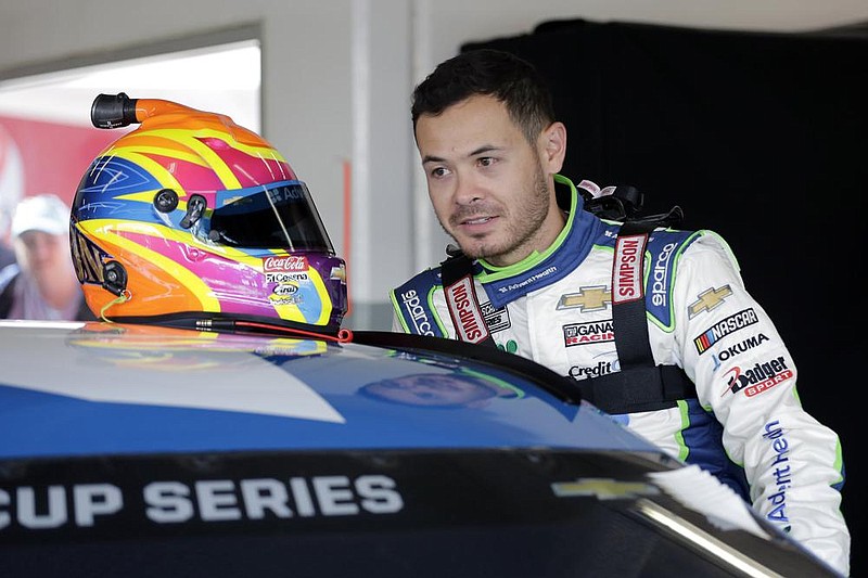  In this Feb, 8, 2020, file photo, Kyle Larson climbs into his car as he gets ready for a NASCAR auto race practice at Daytona International Speedway, in Daytona Beach, Fla. 
(AP Photo/Terry Renna, File)