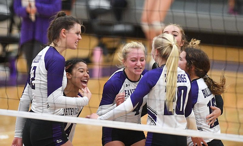 Members of Fayetteville’s volleyball team celebrate after a point during Wednesday’s match against Rogers at the Class 6A state volleyball tournament in Fayetteville. More available photos at arkansasonline.com/1029volley6a.
(NWA Democrat-Gazette/J.T.Wampler)