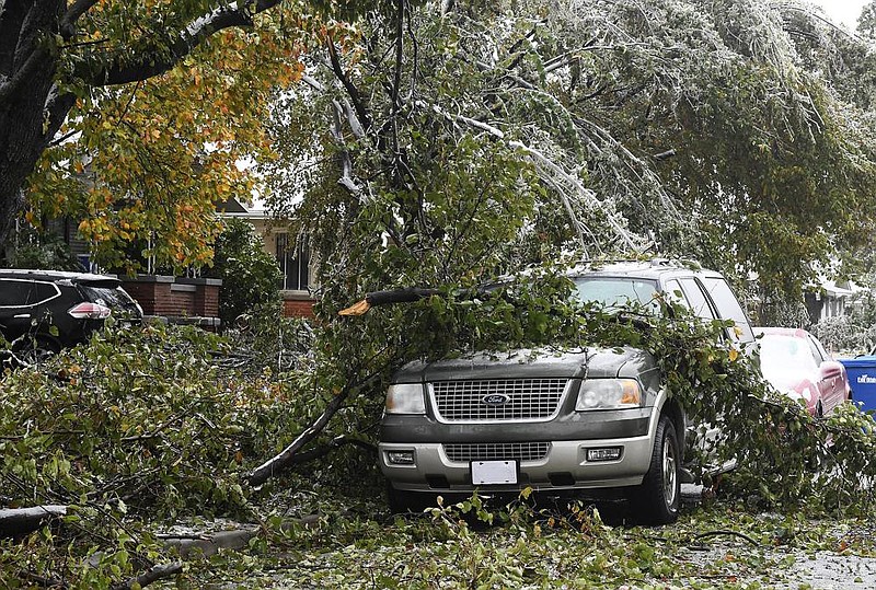 Downed tree limbs rest atop an SUV on Wednesday in Enid, Okla. Gov. Kevin Stitt declared a state of emergency for 47 of the state’s 77 counties because of severe winter weather.
(AP/The Enid News & Eagle/Billy Hefton)