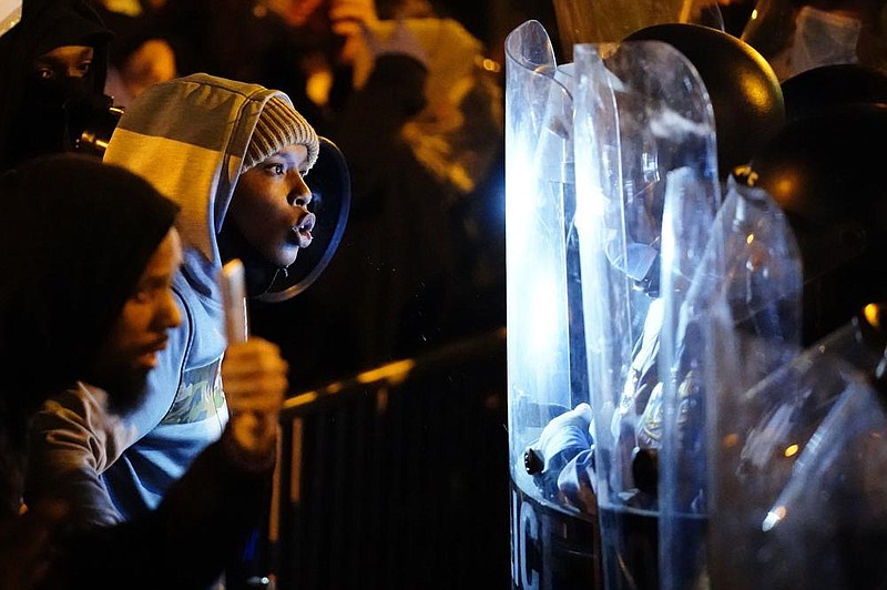 Protesters confront police Tuesday during a march in Philadelphia. More photos at arkansasonline.com/1029philly/
(AP/Matt Slocum)