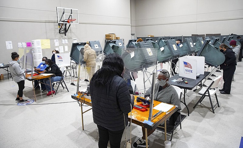 Voters cast their ballots for the general election at Victory Houston polling station in Houston, on Friday, Oct. 30, 2020.