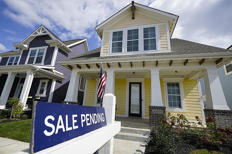 This “sale pending” sign sits in front of a home in Westfield, Ind. A gauge of U.S. pending home sales unexpectedly declined in September for the first time in months.
(AP/Michael Conroy)