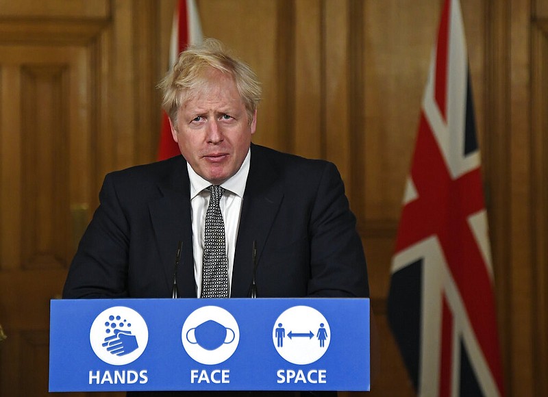 Britain's Prime Minister Boris Johnson speaks during a press conference in 10 Downing Street, London, Saturday, Oct. 31, 2020 where he is expected to announce new restrictions to help combat a coronavirus surge. (AP Photo/Alberto Pezzali, Pool)