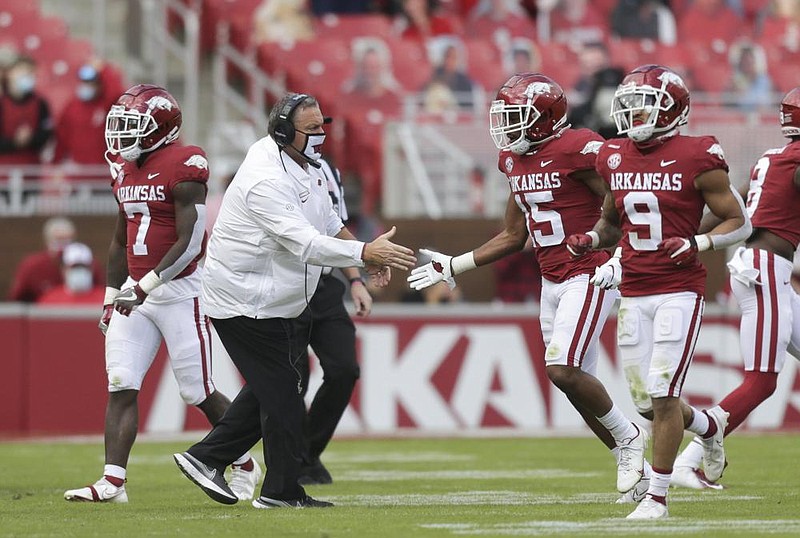 First-year Arkansas Coach Sam Pittman and the Razorbacks will seek to end an eight-game losing streak to Texas A&M tonight at  Kyle Field in College Station, Texas. But the Hogs have already ended lengthy streaks this season, halting a 20-game SEC losing  streak against Mississippi State on Oct. 3, then a 12-game skid in SEC home games against Ole Miss two weeks ago.
(NWA Democrat-Gazette/Charlie Kaijo)
