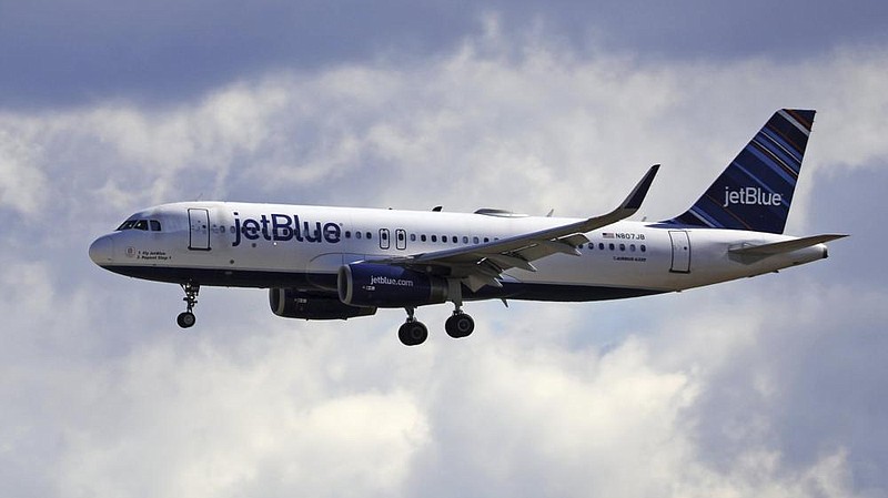 A JetBlue Airways plane lands last year at Salt Lake City International Airport. The sharp decline in  air travel has reduced atmospheric observations from passengers and air crews, affecting weather  forecasting, government researchers say.
(AP/Rick Bowmer)