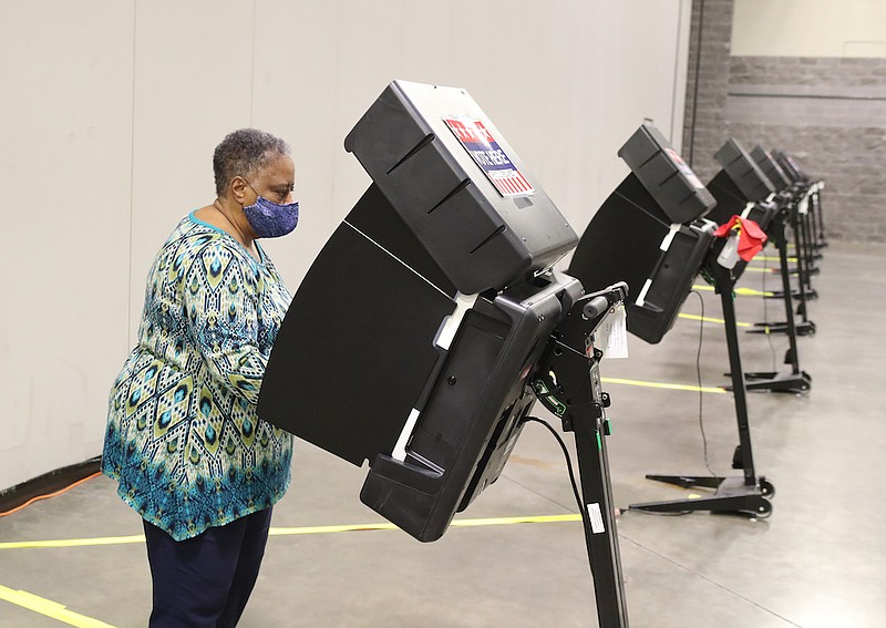 Mary Wilson votes at the Hot Springs Convention Center during the first day of early voting in the 2020 general election. - Photo by Richard Rasmussen of The Sentinel-Record