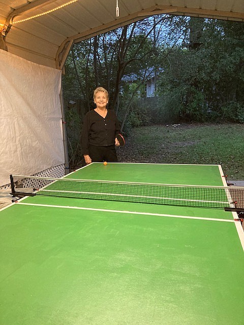 Jane Johnson prepares for a game of ping-pong at her and her husband Scott’s homemade table. Scott Johnson built the ping-pong table with the help of his eldest grandson and the couple have become avid players since the outbreak of the COVID-19 pandemic. (Contributed)