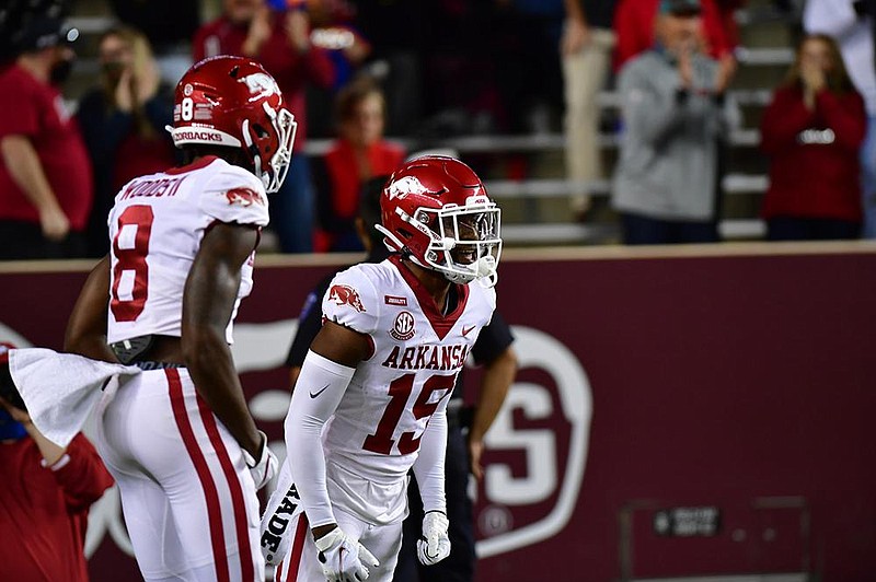 Arkansas receiver Tyson Morris (left) made his first touchdown reception of the season, catching a 1-yard pass from Feleipe Franks in the second quarter. (University of Arkansas/Walt Beazley) 