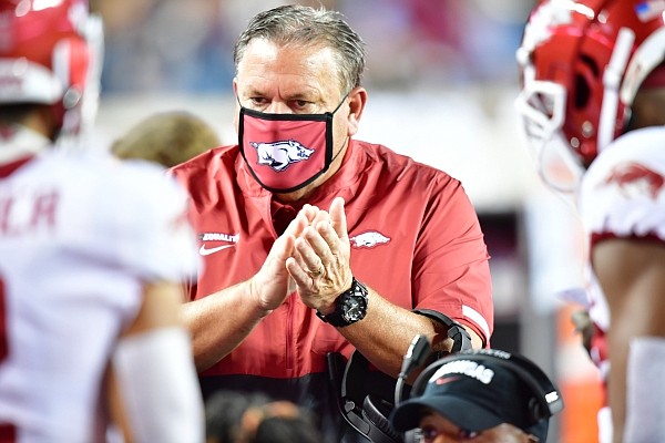 Arkansas coach Sam Pittman claps on the Razorbacks' sideline during a game against Texas A&M on Oct. 31, 2020 in College Station, Texas.