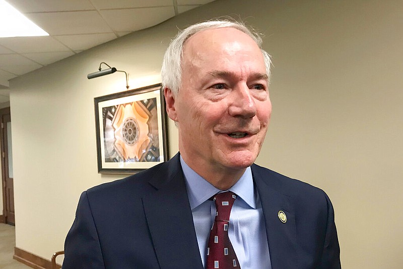 FILE - In this Jan. 13, 2020, file photo, Arkansas Gov. Asa Hutchinson speaks to reporters in Little Rock. 