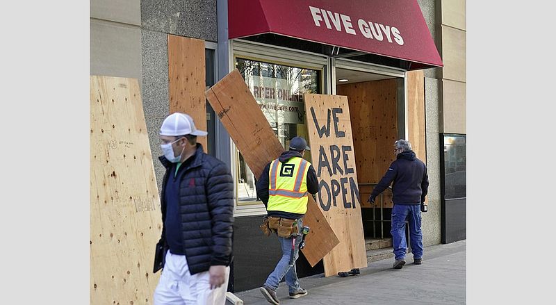 The Domain storefronts boarded up after reports of looting in