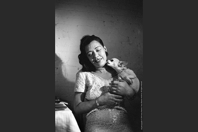 Billie Holiday and her pet chihuahua, Pepi, were photographed backstage at Sugar Hill club in Newark, N.J. It is part of the exhibition “Billie Holiday at Sugar Hill: Photographs by Jerry Dantzic” at the Fort Smith Regional Art Museum. (An earlier version of this photo gave an incorrect city for the club.)

(©️2018 Jerry Dantzic/Jerry Dantzic Archives, All Rights Reserved)