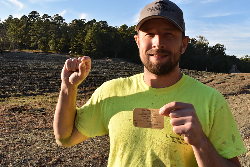 Steven McCool holds a 4.49-carat diamond he found at Crater of Diamonds State Park on Saturday.