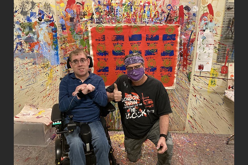 Clayton Stoner (left) is this years featured Easterseals Art & Soul artist. Arkansas artist James Hayes (right) volunteered as a tracker, who serves as the artists hands and arms. (Easterseals Arkansas/Kathryn Norton)