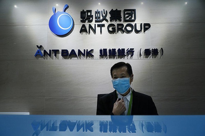 An employee sits at the Ant Group office in Hong Kong in this file photo. The planned stock market debut Thursday of Ant Group was suspended in Shanghai and Hong Kong on Tuesday.
(AP)