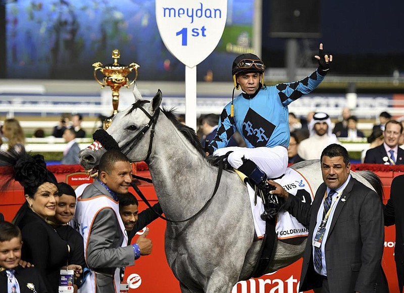X Y Jet, shown here with jockey Emisael Jaramillo aboard after a victory in the $2.5 million Group 1 Dubai Golden Shaheen in March 2019 in Dubai, died of a heart attack in January after being given performance-enhancing drugs. An integrity and safety bill is before the U.S. Senate as part of an effort to have uniform safety standards for the industry to help prevent such deaths.
(AP file photo)