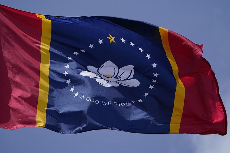 This file photo shows the magnolia centered banner chosen by the Mississippi State Flag Commission displayed outside the Old State Capitol Museum in downtown Jackson, Miss. Voters approved the design in the general election Tuesday.
(AP/Rogelio V. Solis)