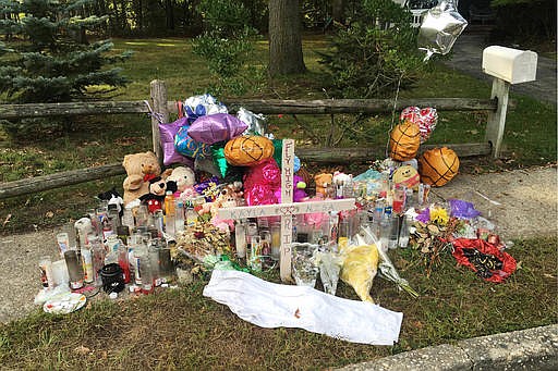 A memorial for two teen girls, believed to be victims of gang violence, is seen in Brentwood, N.Y., in this Sept. 27, 2016, file photo.