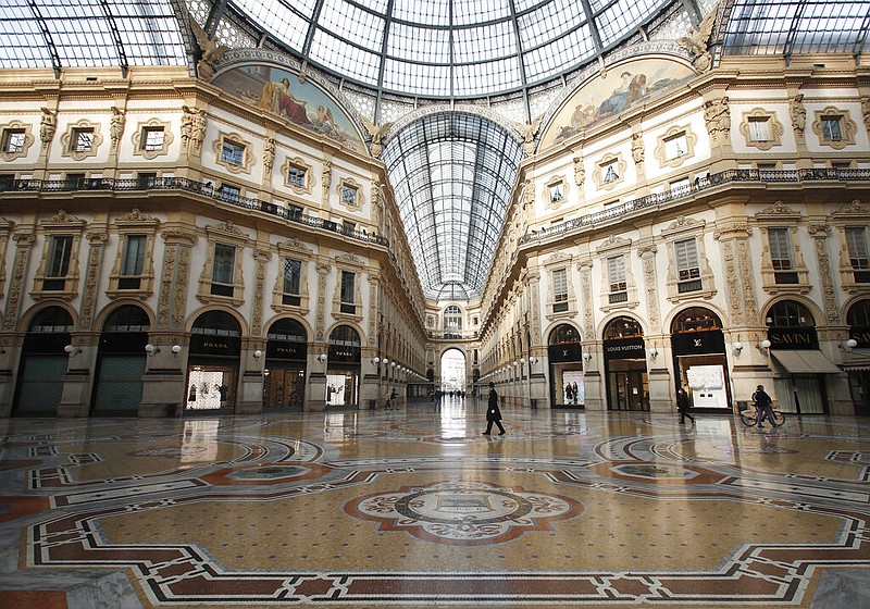 A city police officer walks in the Vittorio Emanuele II gallery shopping arcade in downtown Milan, Italy, Friday, Nov. 6, 2020. Lombardy is among the four Italian regions classified as red zones, where a strict lockdown was imposed starting Friday - to be reassessed in two weeks - in an effort to curb the covid-19 infections growing curve. Starting today, only shops selling food and other essentials are allowed to open. (AP Photo/Antonio Calanni)

