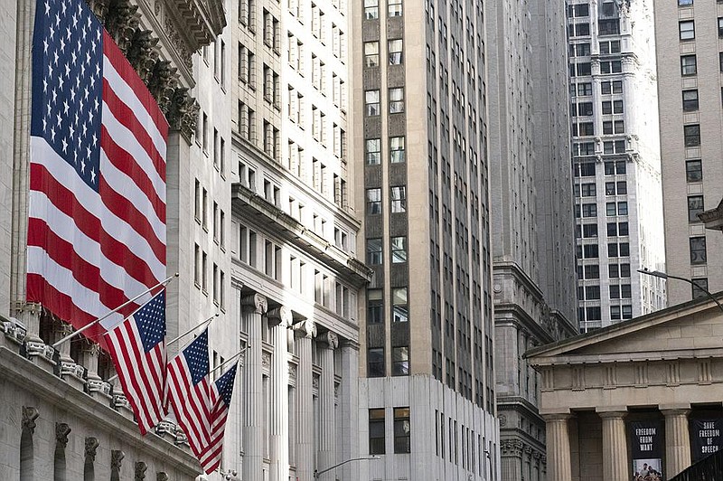 United States flags hang from the New York Stock Exchange on Thursday. Stocks surged again as investors awaited the outcome of the U.S. presidential election and embrace the upside of more gridlock in Washington.
(AP/Mark Lennihan)