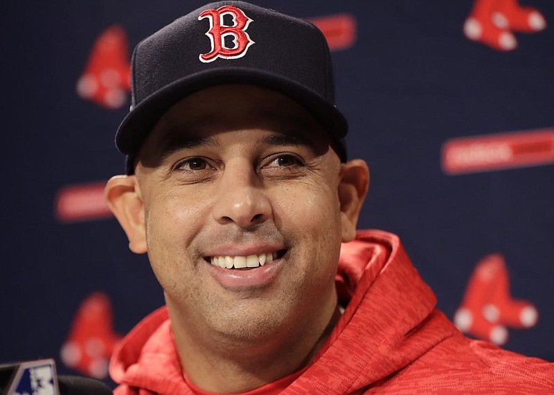 Boston Red Sox manager Alex Cora speaks to media during a baseball work out at Fenway Park, Sunday, Oct. 21, 2018, in Boston, as they prepare for Game 1 of the World Series against the Los Angeles Dodgers scheduled for Tuesday in Boston. (AP Photo/Elise Amendola)