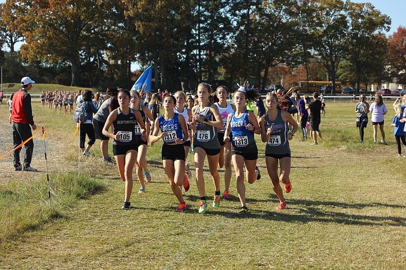 Fayetteville sophomore Carson Wasemiller (center) is flanked by Rogers’ Mia Loafman (left) and Ali Nachtigal during the Class 6A girls cross country championship Friday at Hot Springs. Wasemiller won the race in 18:14.04, while Loafman was second and Nachtigal third.
(The Sentinel-Record/James Leigh)