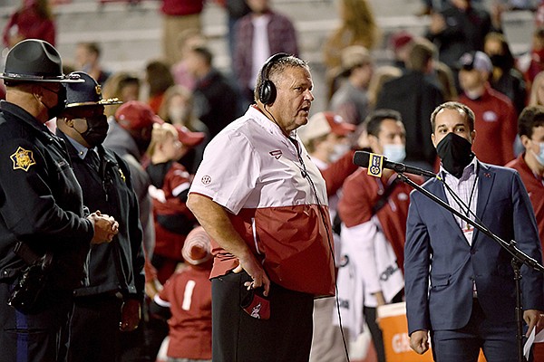 Arkansas coach Sam Pittman does his interview following the team's 24-13 win over Tennessee in an NCAA college football game Saturday, Nov. 7, 2020, in Fayetteville. (AP Photo/Michael Woods)