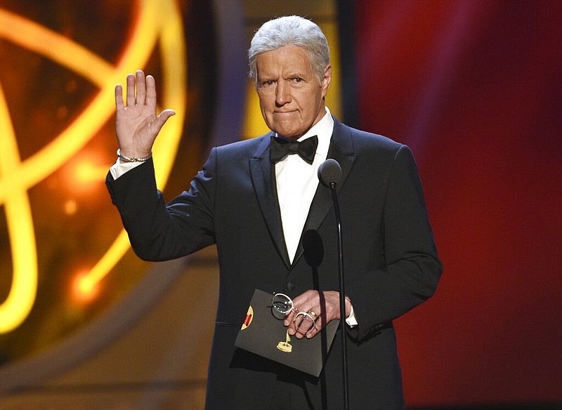 Alex Trebek gestures while presenting an award at the 46th annual Daytime Emmy Awards in Pasadena, Calif., in this May 5, 2019, file photo. The longtime "Jeopardy!” host died Sunday, Nov. 8, 2020, after battling pancreatic cancer for nearly two years. Trebek died at home with family and friends surrounding him, “Jeopardy!” studio Sony said in a statement. (Photo by Chris Pizzello/Invision/AP, File)
story.lead_photo.caption
