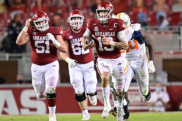 Arkansas quarterback Feleipe Franks (13) carries the ball during a game against Tennessee on Saturday, Nov. 7, 2020, in Fayetteville. 