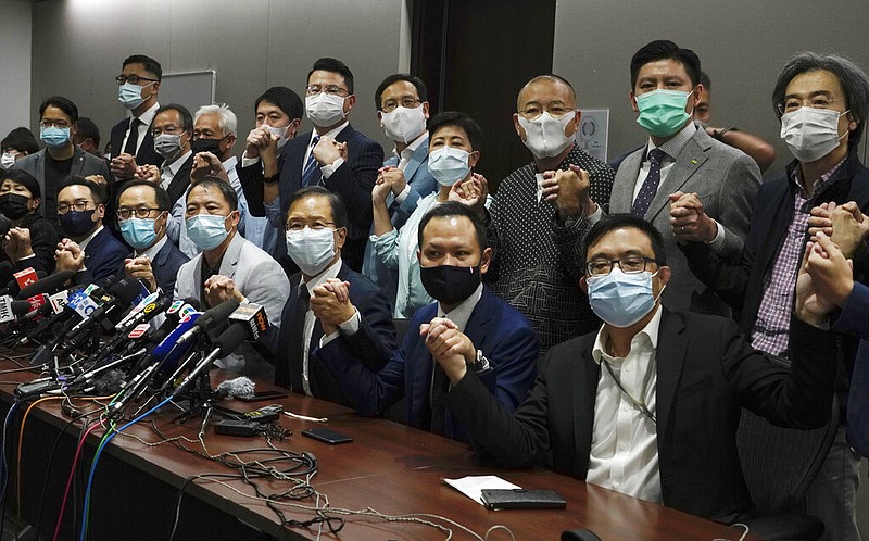 Hong Kong's pro-democracy legislators pose for a photo before a press conference at Legislative Council in Hong Kong, Wednesday, Nov. 11, 2020. story.lead_photo.caption
