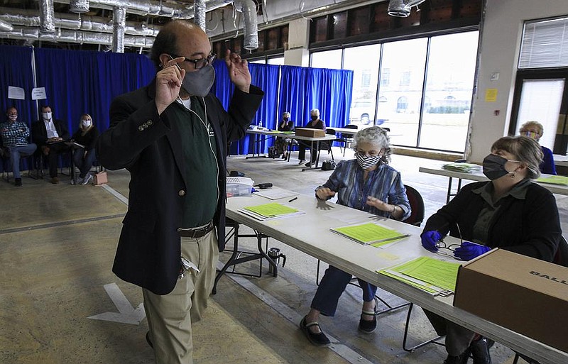 Bryan Poe, left, director of elections, instructs officials to continue counting, Tuesday Nov. 10, 2020, during the tabulation of provisional ballots cast for the Nov. 3 election. (Arkansas Democrat-Gazette/Staton Breidenthal)