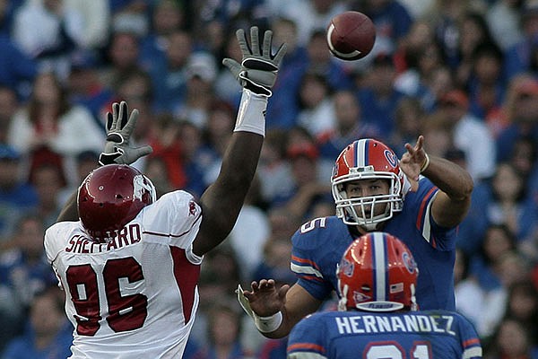 Arkansas defensive lineman Malcolm Sheppard (96) defends a pass thrown by Florida quarterback Tim Tebow during a game Saturday, Oct. 17, 2009, in Gainesville, Fla. 
