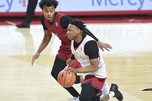 Arkansas guards JD Notae (1) and Moses Moody (5) run down the court during the Razorbacks' Red-White Game on Thursday, Nov. 12, 2020, in Fayetteville. 