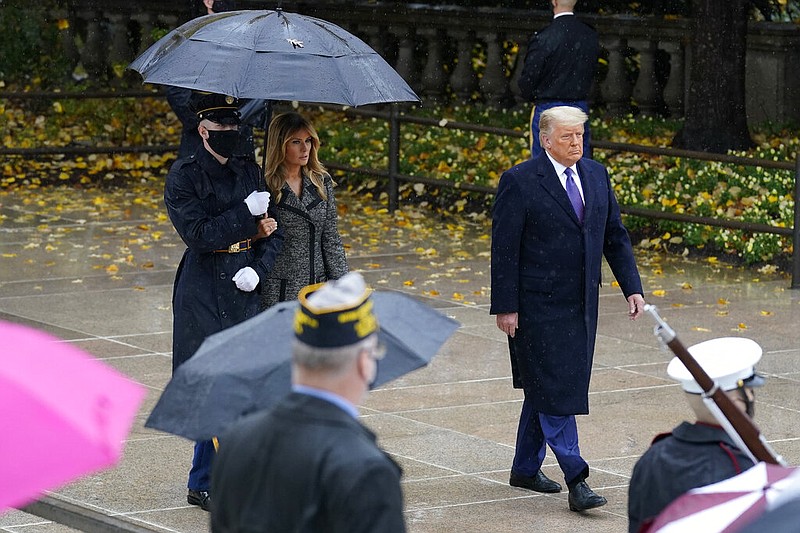 President Donald Trump and first lady Melania Trump arrive to participate in a Veterans Day wreath-laying ceremony at the Tomb of the Unknown Soldier at Arlington National Cemetery in Arlington, Va., on Wednesday, Nov. 11, 2020.