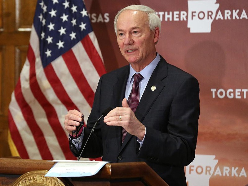 Gov. Asa Hutchinson answers a question during a press conference on Friday, Nov. 13, at the state Capitol in Little Rock. (Arkansas Democrat-Gazette/Thomas Metthe)