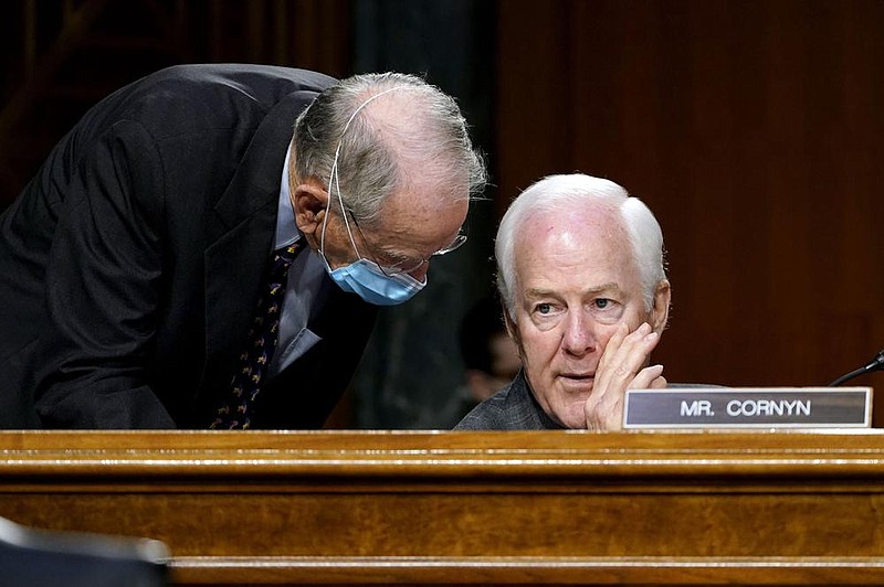 Sen. Charles Grassley (left), R-Iowa, and Sen. John Cornyn, R-Texas, confer during a Senate Judiciary Committee hearing Tuesday. Both said Thursday that former Vice President Joe Biden should be getting classified briefings despite President Donald Trump’s refusal to concede the election. “I just think it’s part of the transition,” Cornyn said. “And uh, if in fact he does win in the end, I think they need to be able to hit the ground running.”
(AP/Susan Walsh)