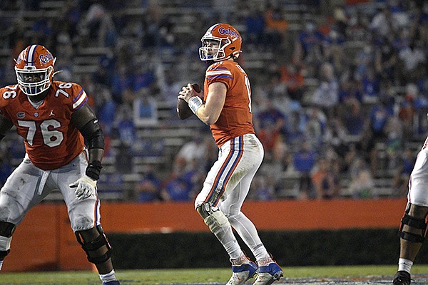 Florida quarterback Kyle Trask (11) sets up to throw a pass during the second half of an NCAA college football game against Arkansas, Saturday, Nov. 14, 2020, in Gainesville, Fla. (AP Photo/Phelan M. Ebenhack)


