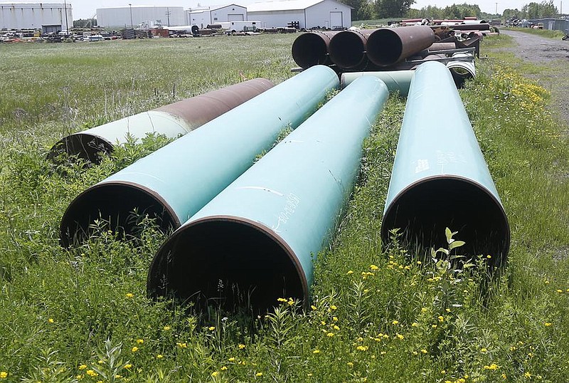 Sections of pipe used to carry crude oil are shown at the Superior, Wis., terminal of Enbridge Energy  in 2018. Michigan is seeking to revoke a 1953 easement that allows Enbridge to operate under the  Straits of Mackinac between Lake Huron and Lake Michigan.
(AP/Jim Mone)