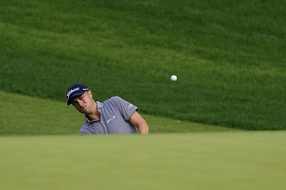 Justin Thomas chips to the 10th hole during the second round of the Masters on Friday in Augusta, Ga. Thomas was among four golfers who shared the lead at 9 under after Friday’s second round.
(AP/Matt Slocum)