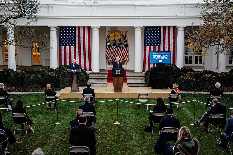 Vice President Mike Pence (left) and President Donald Trump deliver an update on coronavirus vaccine developments. Trump said vaccines would “arrive within a few weeks” and ruled out a national lockdown in the meantime.
(The New York Times/Anna Moneymaker)