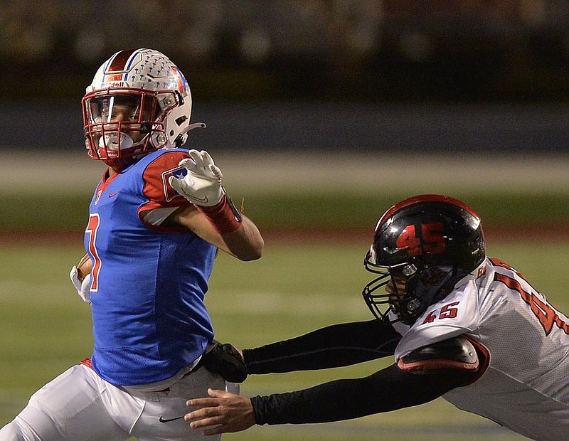 Little Rock Parkview running back Willie Eackles (left) runs away from Searcy linebacker Zimri Anderson during the Patriots’ 42-7 victory over the Lions on Friday at War Memorial Stadium in Little Rock. More photos at arkansasonline.com/1114searcyparkview/.
(Special to the Democrat-Gazette/Jimmy Jones)