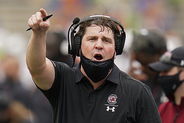 South Carolina head coach Will Muschamp has words with an official during the first half of an NCAA college football game against Florida, Saturday, Oct. 3, 2020, in Gainesville, Fla. (AP Photo/John Raoux)