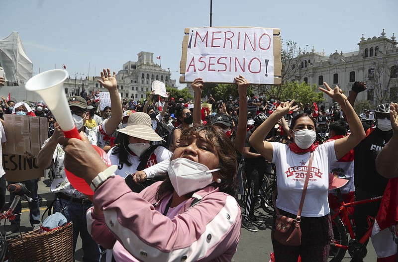People celebrate after the resignation of interim president Manuel Merino, at Plaza San Martin in Lima, Peru, Sunday, Nov. 15, 2020. Merino resigned after a violent crackdown on protests that left at least two people dead followed by an exodus of his cabinet members. (AP Photo/Martin Mejia)