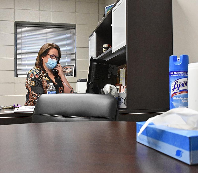 Becky Dixon, mental health coordinator for Smackover schools, takes a phone call in her office Nov. 12. She is the rare school-employed therapist, available all day to see students who need help. When the pandemic hit, Dixon said many of her youngest clients went missing, but most are now back in school and getting help from her.
(Arkansas Democrat-Gazette/Staci Vandagriff)