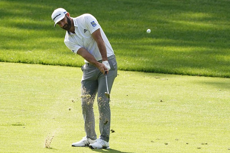 Dustin Johnson chips to the third green during the third round of the Masters on Saturday in Augusta, Ga. Johnson is at 16 under for a four-shot lead heading into today’s final round. More photos at arkansasonline.com/1115masters/
(AP/Matt Slocum)