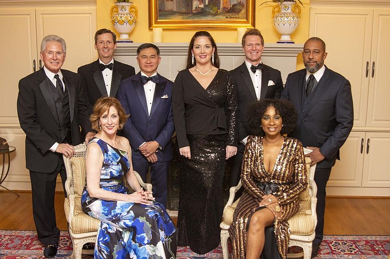 Carole Smith (seated), Marvin Maurras, John Monroe, Bill Yee, Amber McKnight, Chris White, and Scott Hamilton (all in back) and Marti Hamilton (seated) 