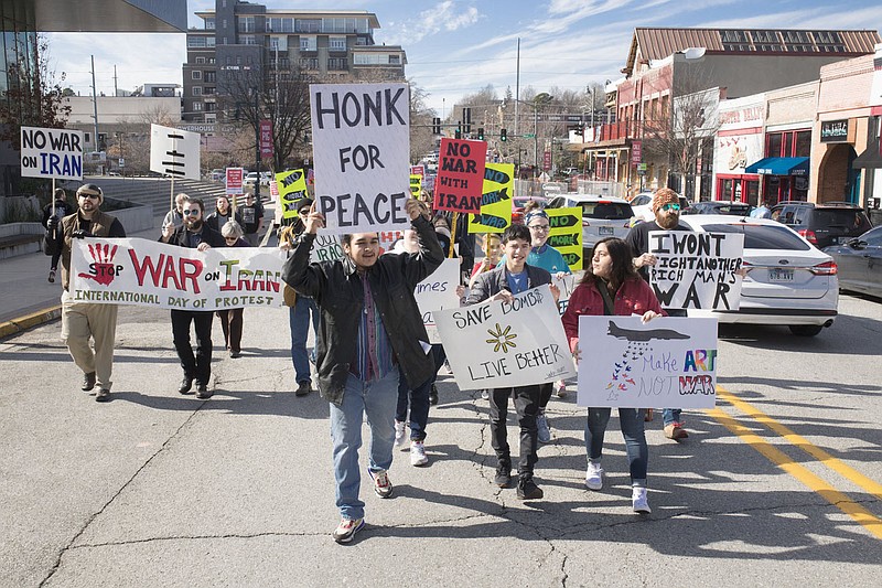 Attendees march, Saturday, January 25, 2020 during a protest march and rally for peace that started on Dickson Street and ended at the square in Fayetteville. Check out nwaonline.com/200126Daily/ for today’s photo gallery.
(NWA Democrat-Gazette/Charlie Kaijo)

The OMNI Center and Arkansas Nonviolence Alliance held a protest march and rally for peace, calling for a stop to war with Iran and endless wars everywhere.

The rally featured several musicians and speakers, including OMNI Founder Dr. Dick Bennett, Afghanistan war veteran Nathan Hudson, University of Arkansas students, and other leaders and activists.

This event was part of an International Day of Protest organized and endorsed by dozens of national organizations for justice and peace. 