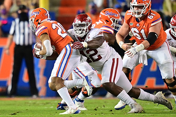 Arkansas defensive lineman Jonathan Marshall (42) attempts to tackle Florida running back Malik Davis during a game Saturday, Nov. 14, 2020, in Gainesville, Fla. Arkansas defensive lineman Jonathan Marshall (42) attempts to tackle Florida running back Malik Davis during a game Saturday, Nov. 14, 2020, in Gainesville, Fla.